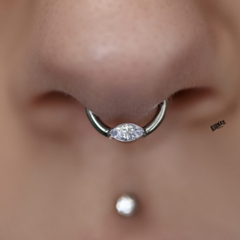 septum piercing with a marquise diamond clicker